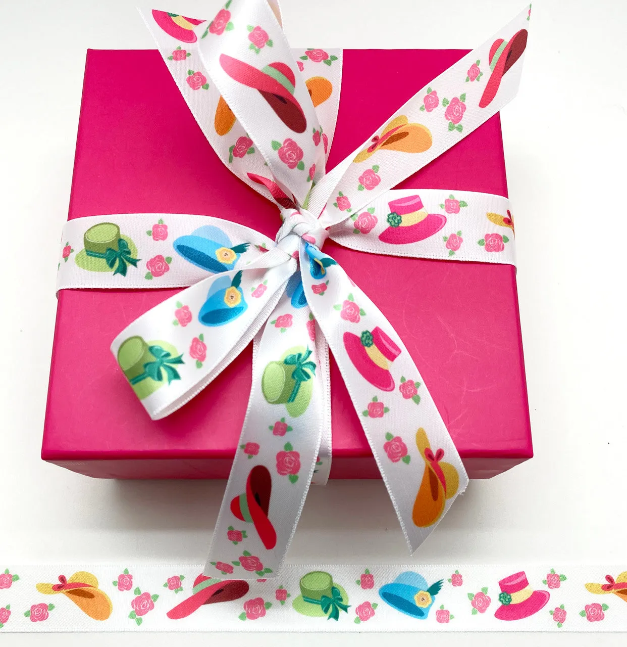 Ladies Hats Ribbon bonnets of pink, yellow, blue and green tossed with rose budsprinted on 7/8" white single face satin